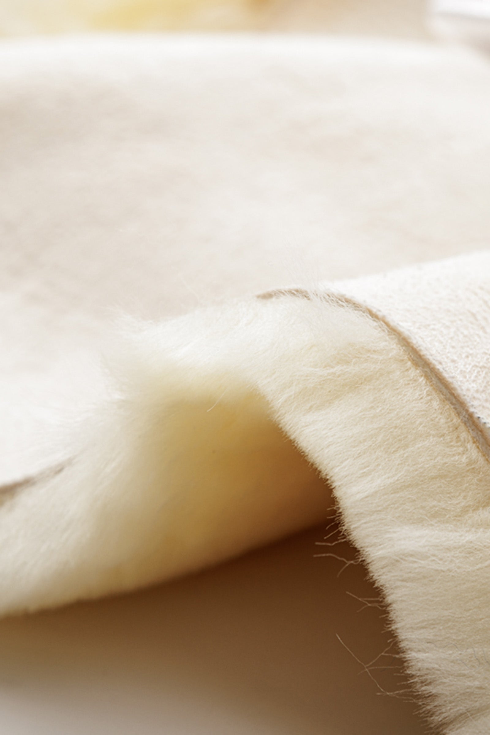 Demi-coussin matelassé en peau de mouton Classic Jump Demi-coussin matelassé en peau de mouton Classic Jump